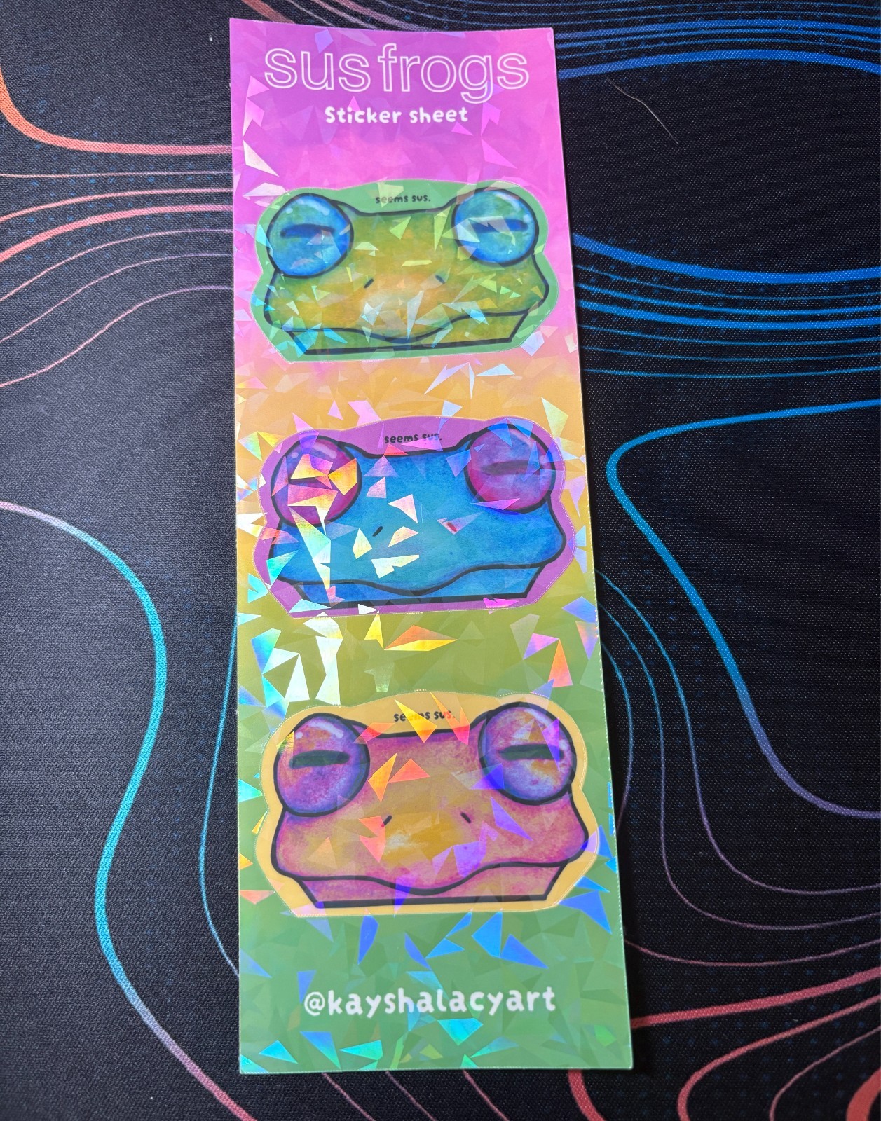 Seems Sus Frogs Holographic Waterproof Vinyl Sticker Sheet by KayshaLacyArt