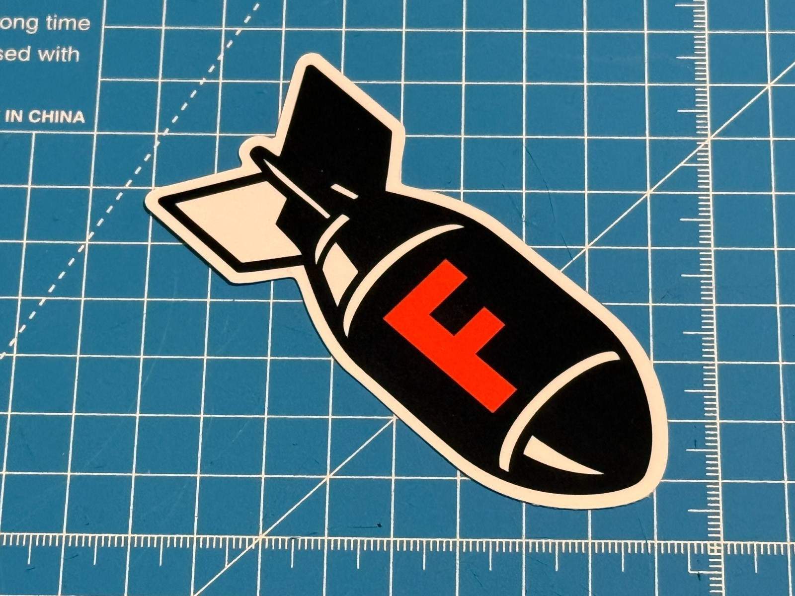 "F Bomb" Black & Orange Vinyl Sticker – Water-Resistant & Tear-Resistant Decal