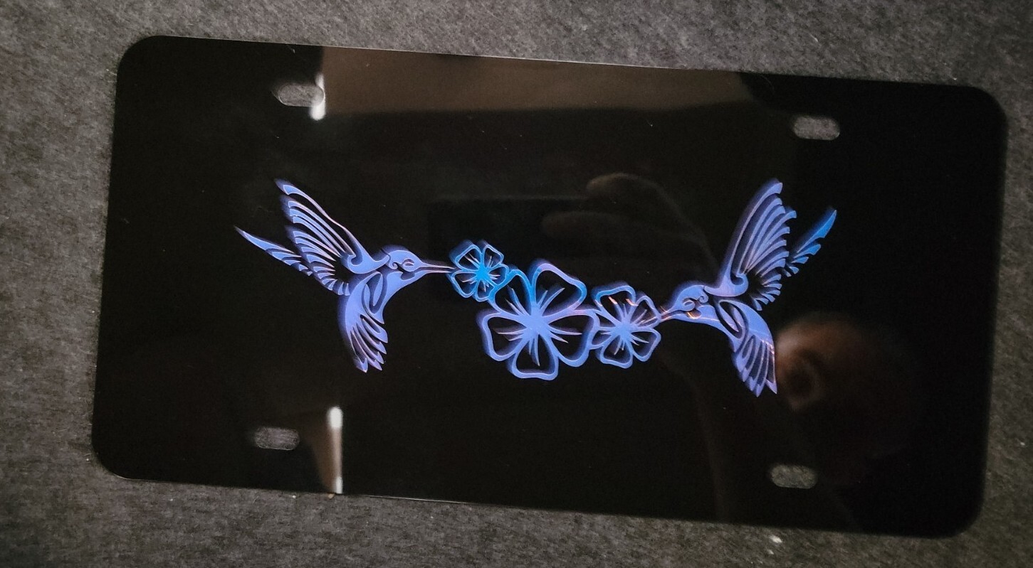Hummingbirds / Plumeria Flowers Vinyl Decal On Black Car License Plate