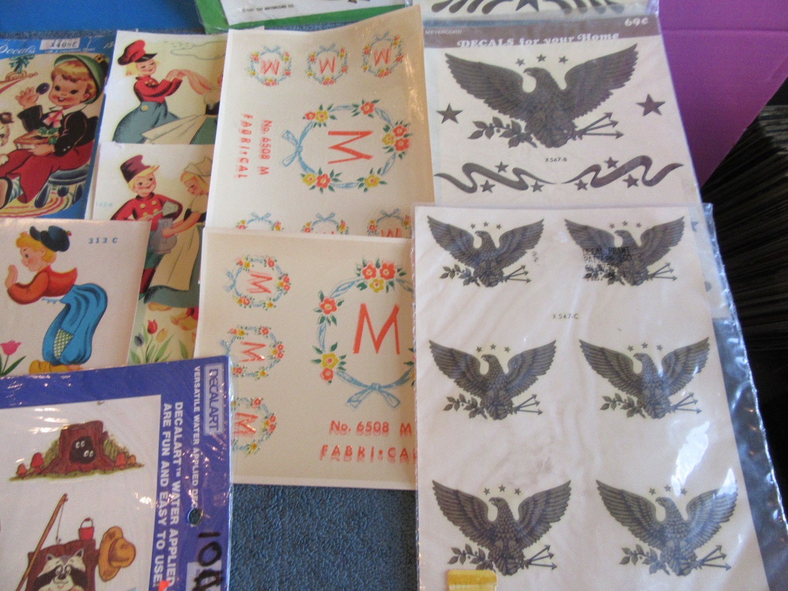 15 Meyercord decal transfer art eagle dutch boy girl M raccoon NEW