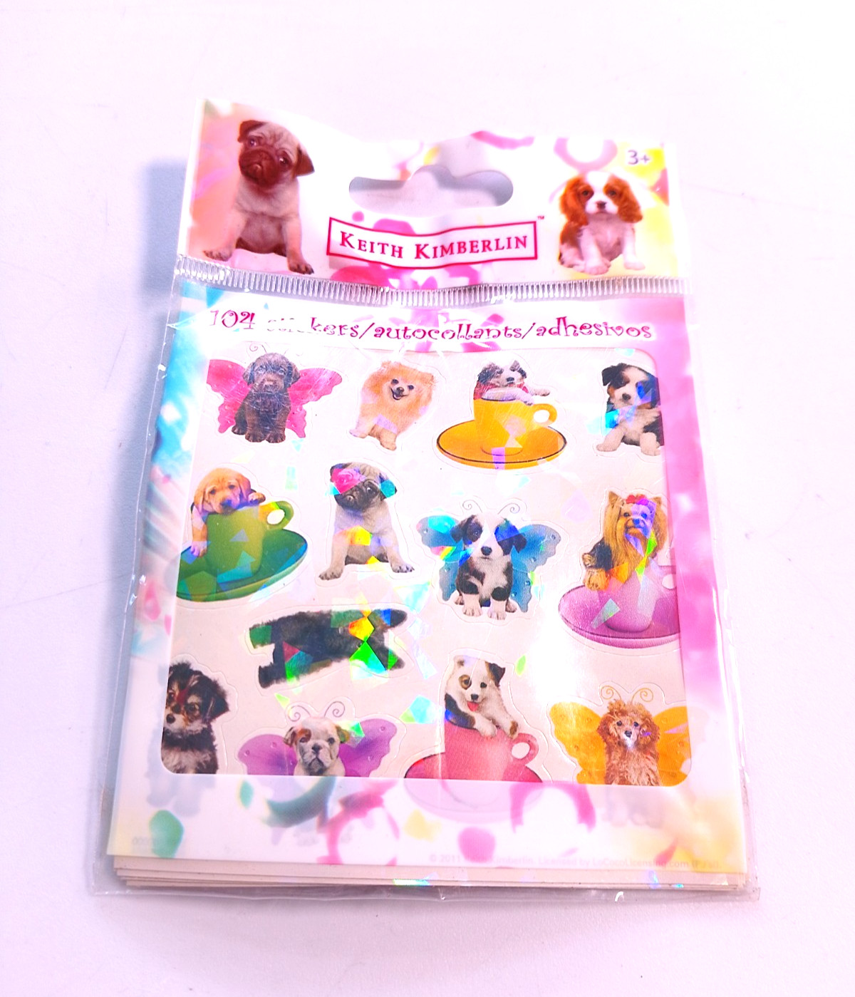 Box 95 – Keith Kimberlin colorful puppy stickers sealed in bag
