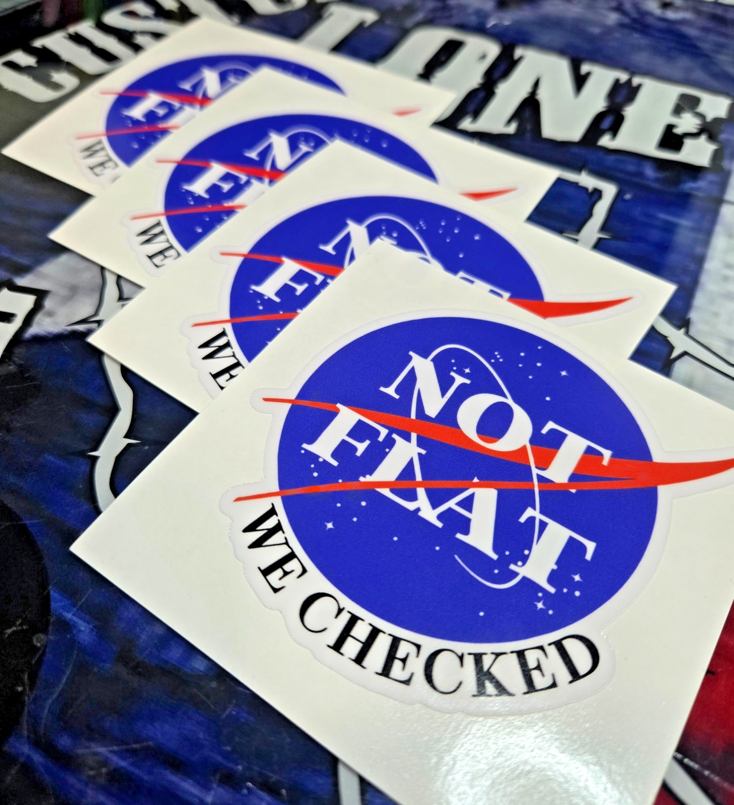 LAMINATED NOT FLAT, WE CHECKED STICKER