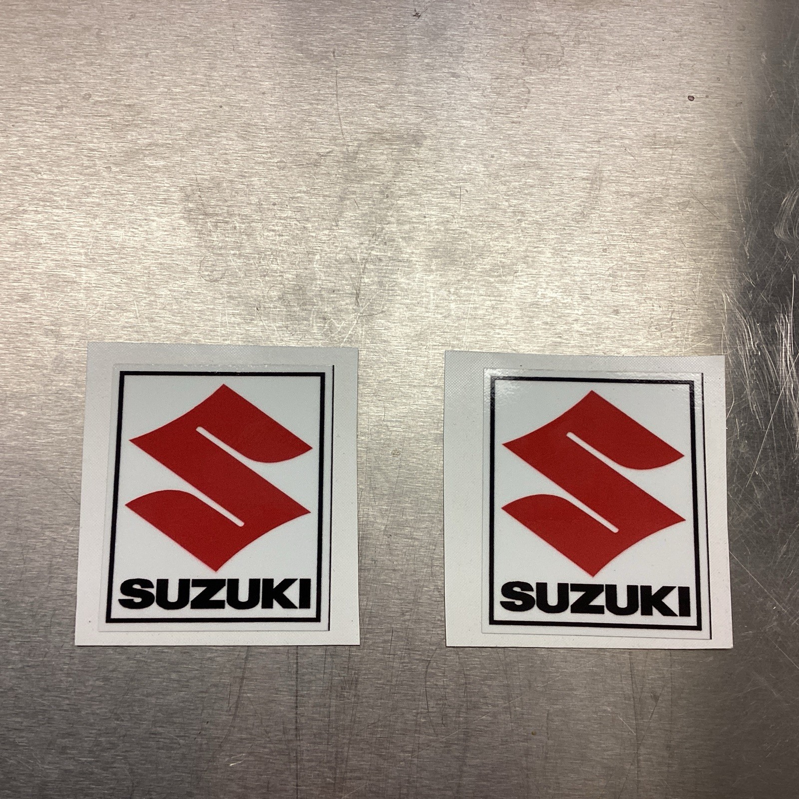 A Pair of Vintage Suzuki Red S Logo Decal Stickers 125 250 370 400