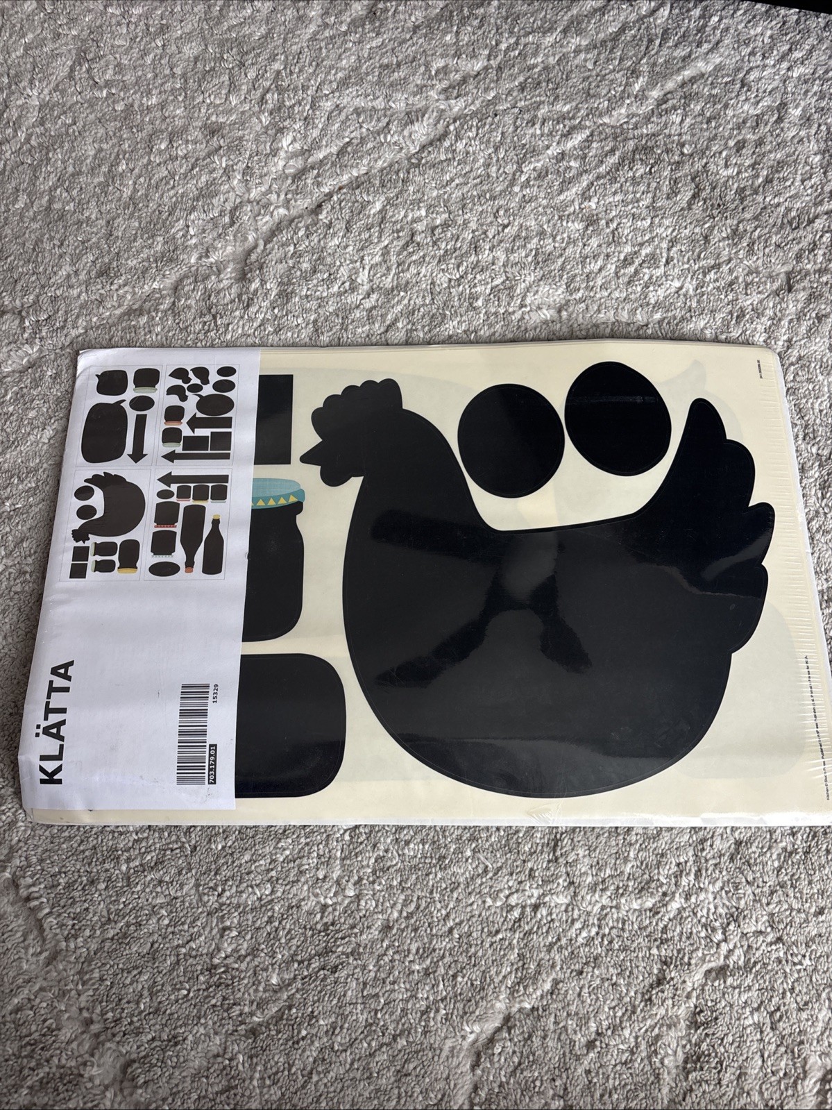 IKEA KLÄTTA wall stickers featuring black hen and bottle designs.