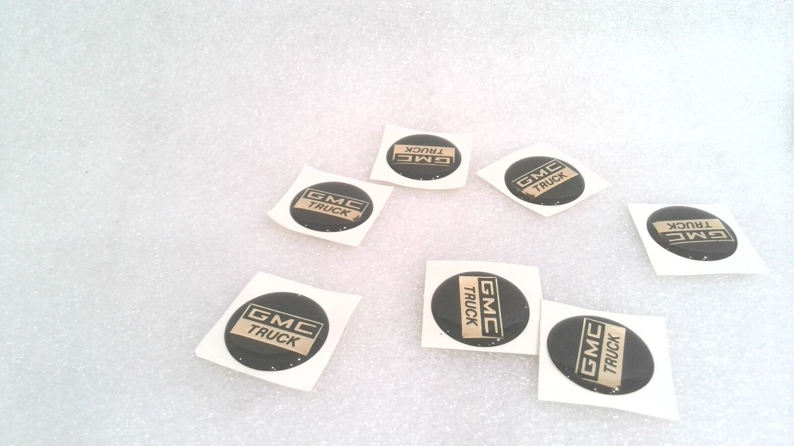 GMC TRUCK DOMED STICKER, BLACK/GOLD, 2 MM X 1.1" (LOT OF 18)