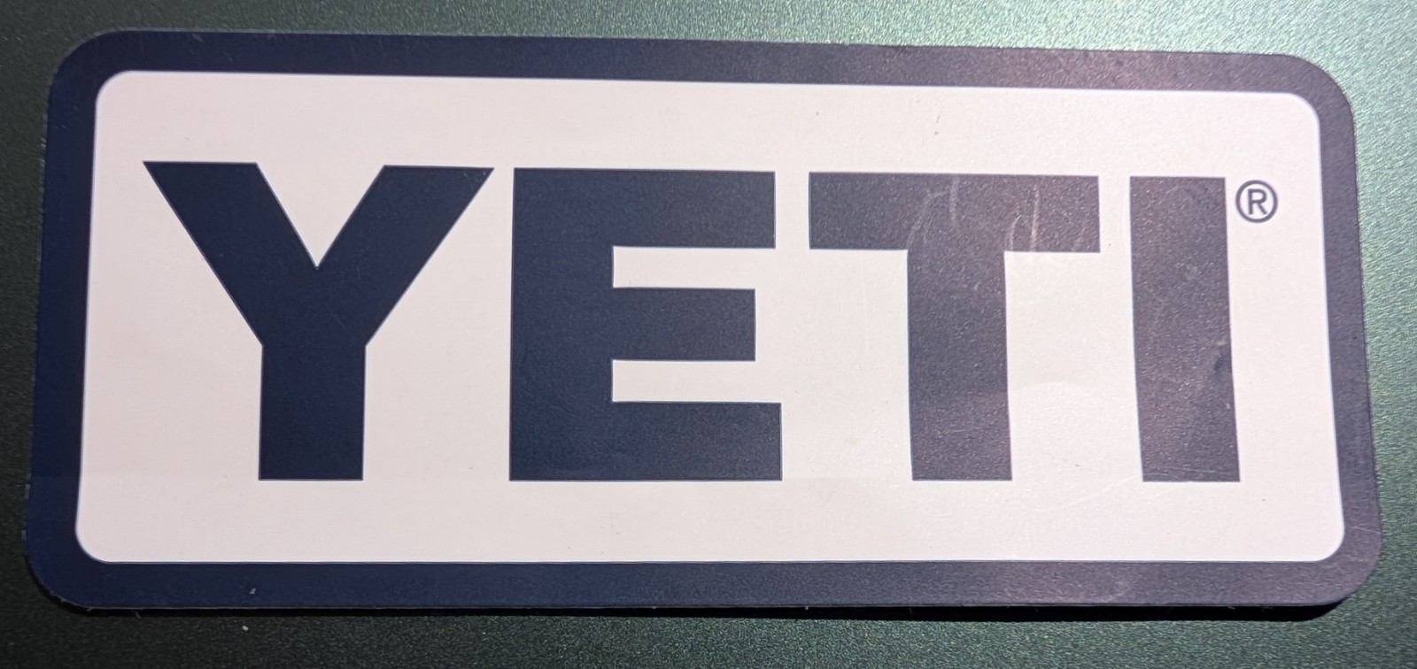 Yeti Sticker Authentic 1.75 X 4" Black Letters & Trim On White Background