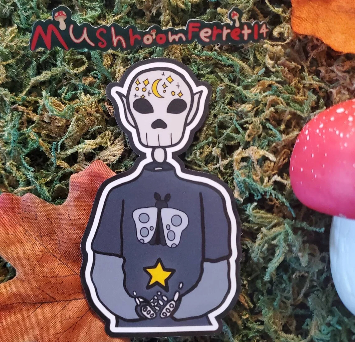 Handmade "Skeleton in Moth Shirt" die cut sticker. See description!