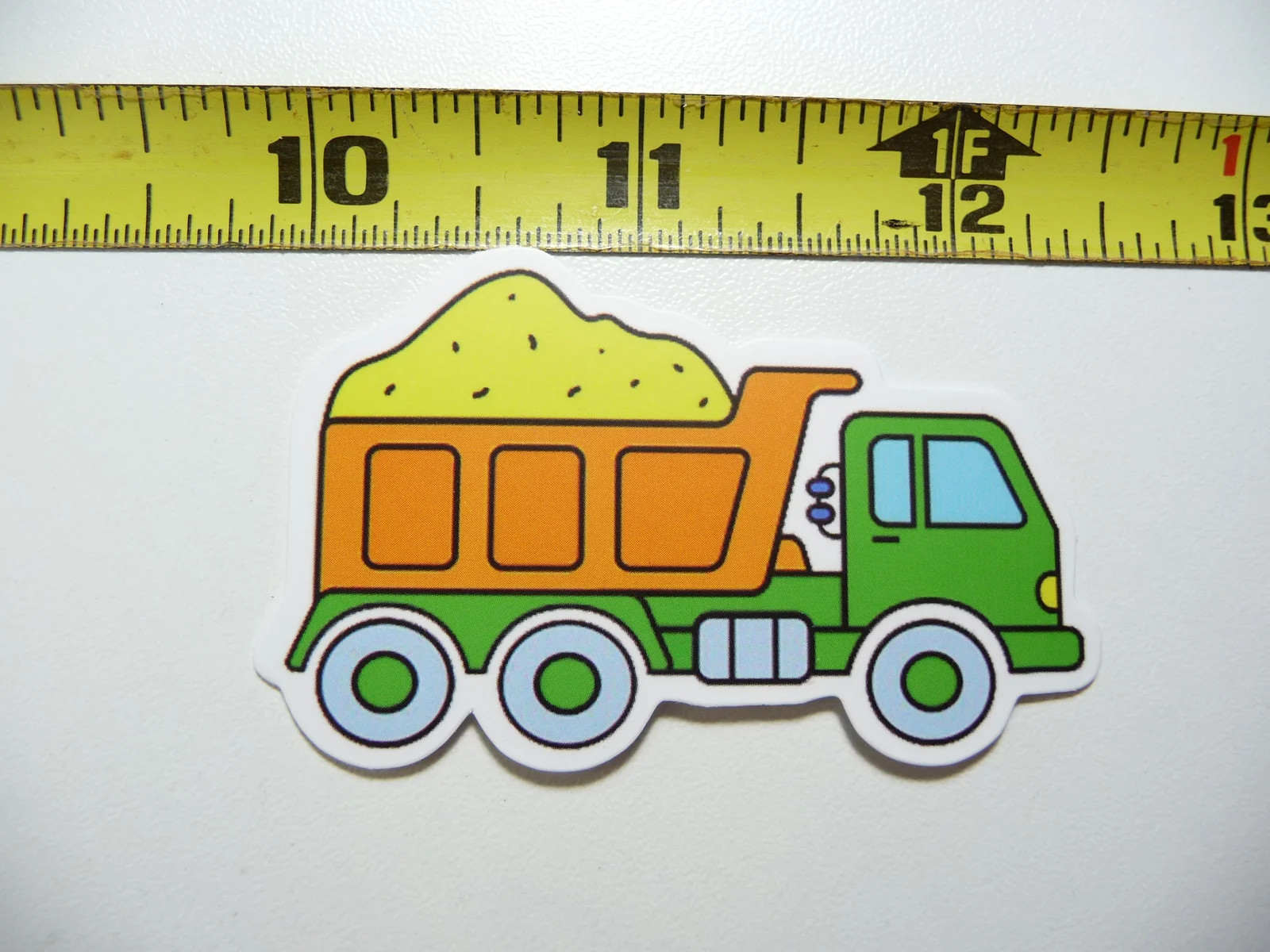 CARTOON DUMP TRUCK WITH DIRT SMALL STICKER DECAL HEAVY EQUIPMENT CONSTRUCTION