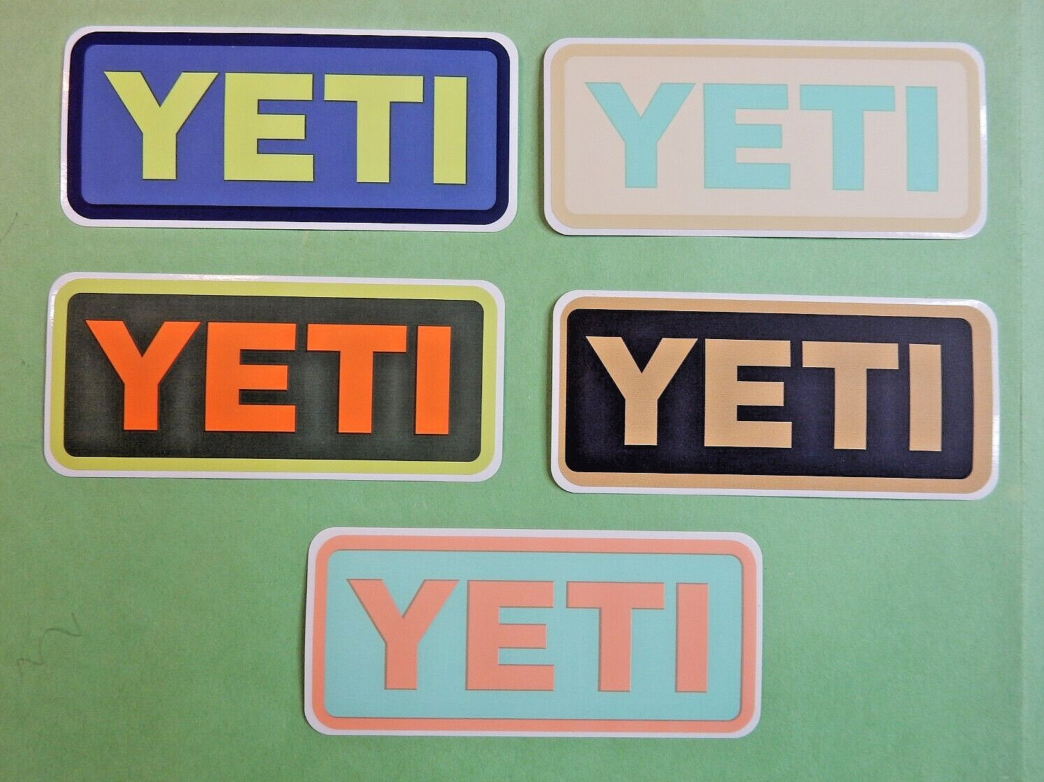 Set of 5 New Multi Colored YETI STICKERS 2" x 4" nominal