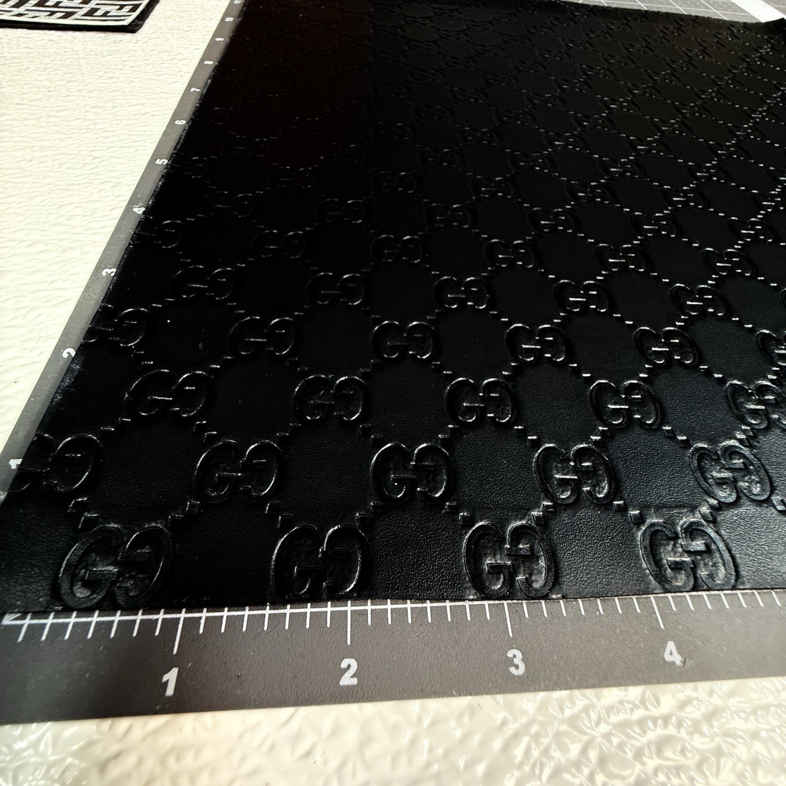G.G. Black Embossed Monogram Vinyl For Crafting piece 12" X 12"