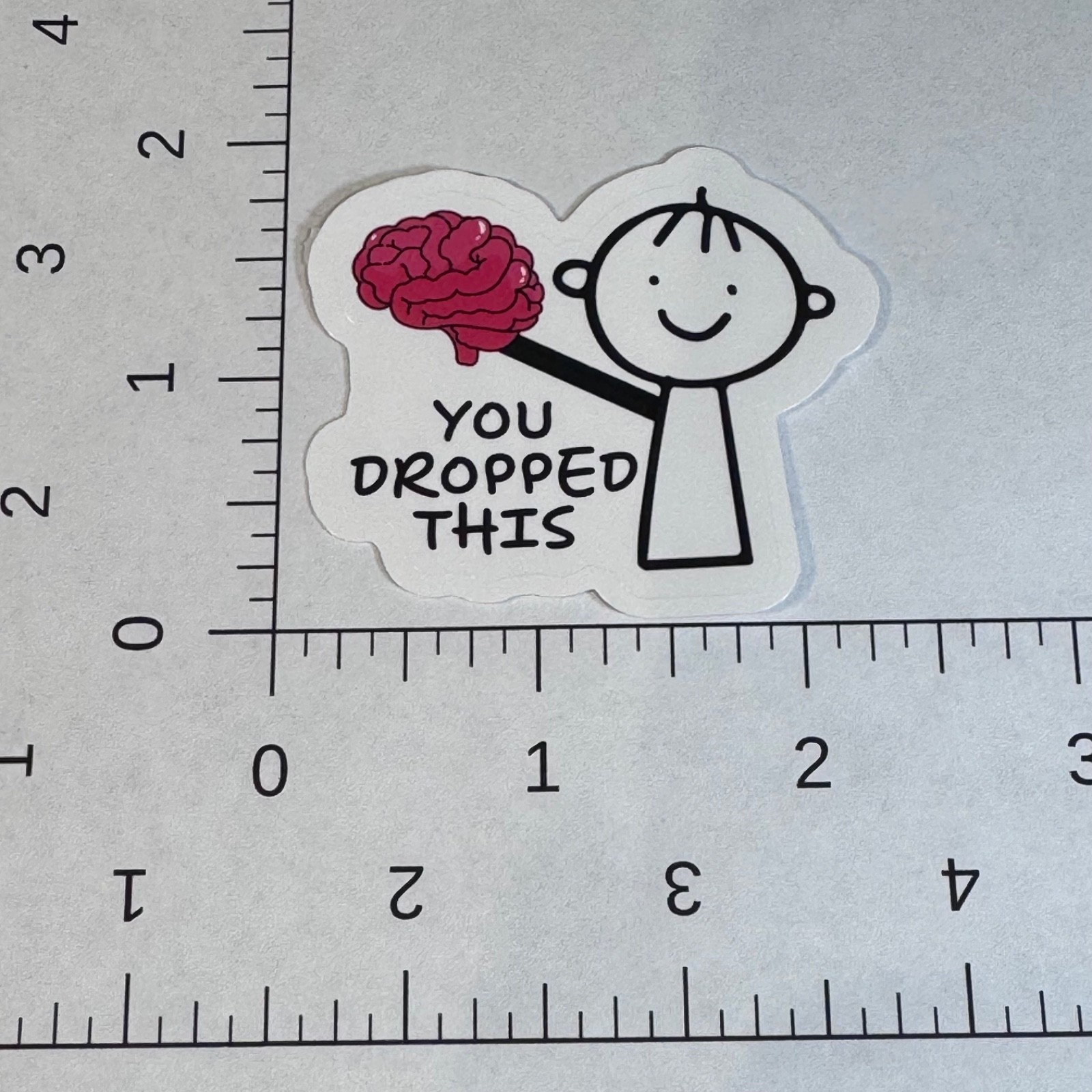 Stick figure with brain sticker -You dropped this – water bottle locker student