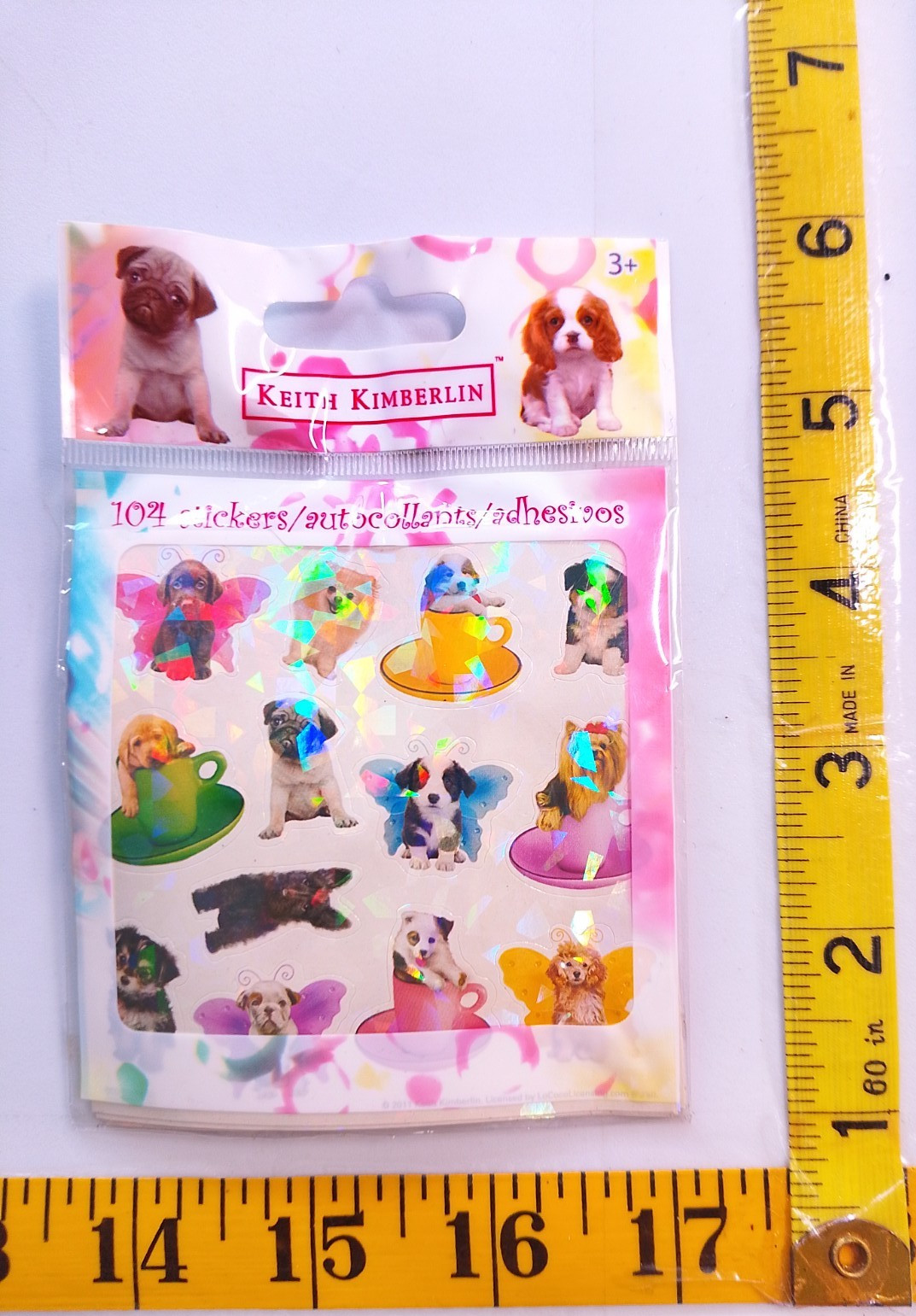 Box 95 – Keith Kimberlin colorful puppy stickers sealed in bag