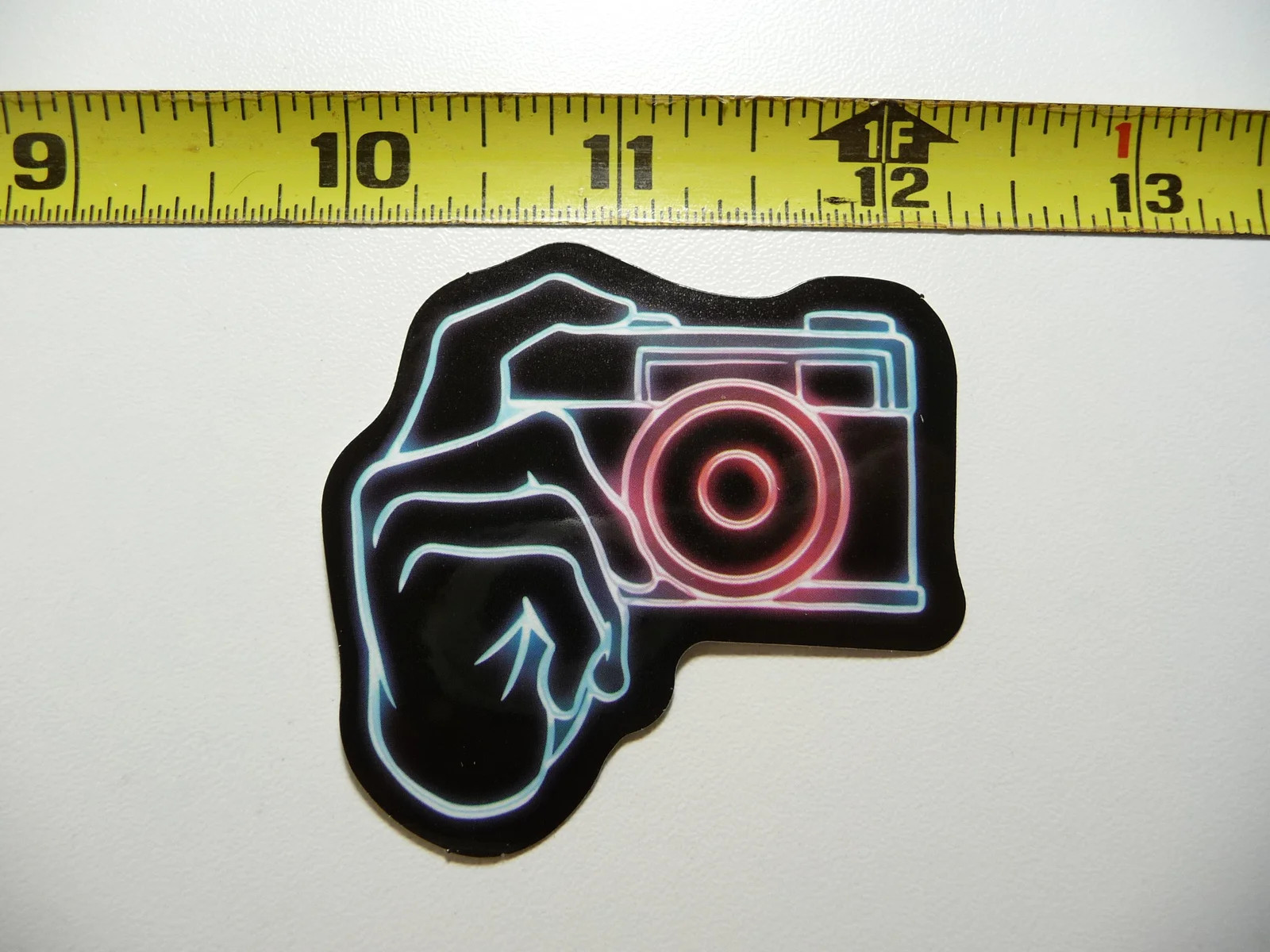 NEON SMALL STICKER DECAL CAMERA HAND TAKING PHOTO LAPTOP FUNNY DECORATION