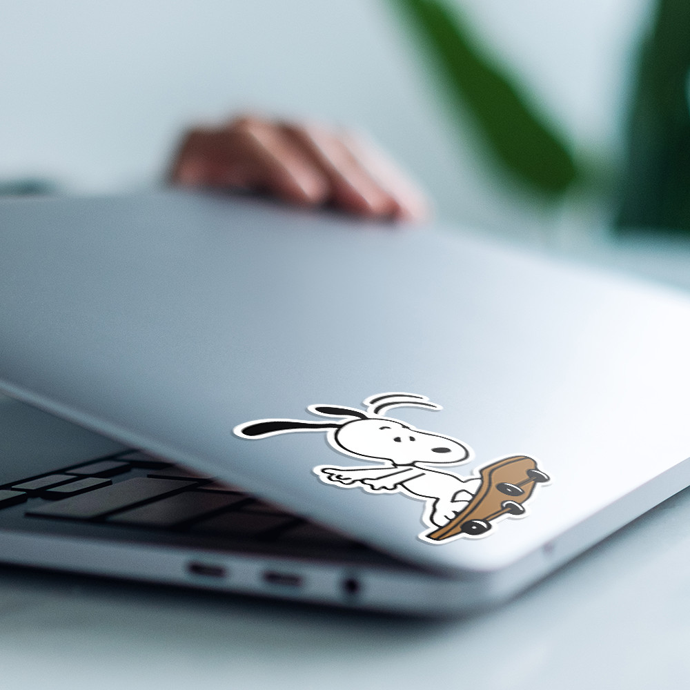 Peanuts Snoopy playing with a skateboard, cute and fun sticker 4"W x 4.5"H
