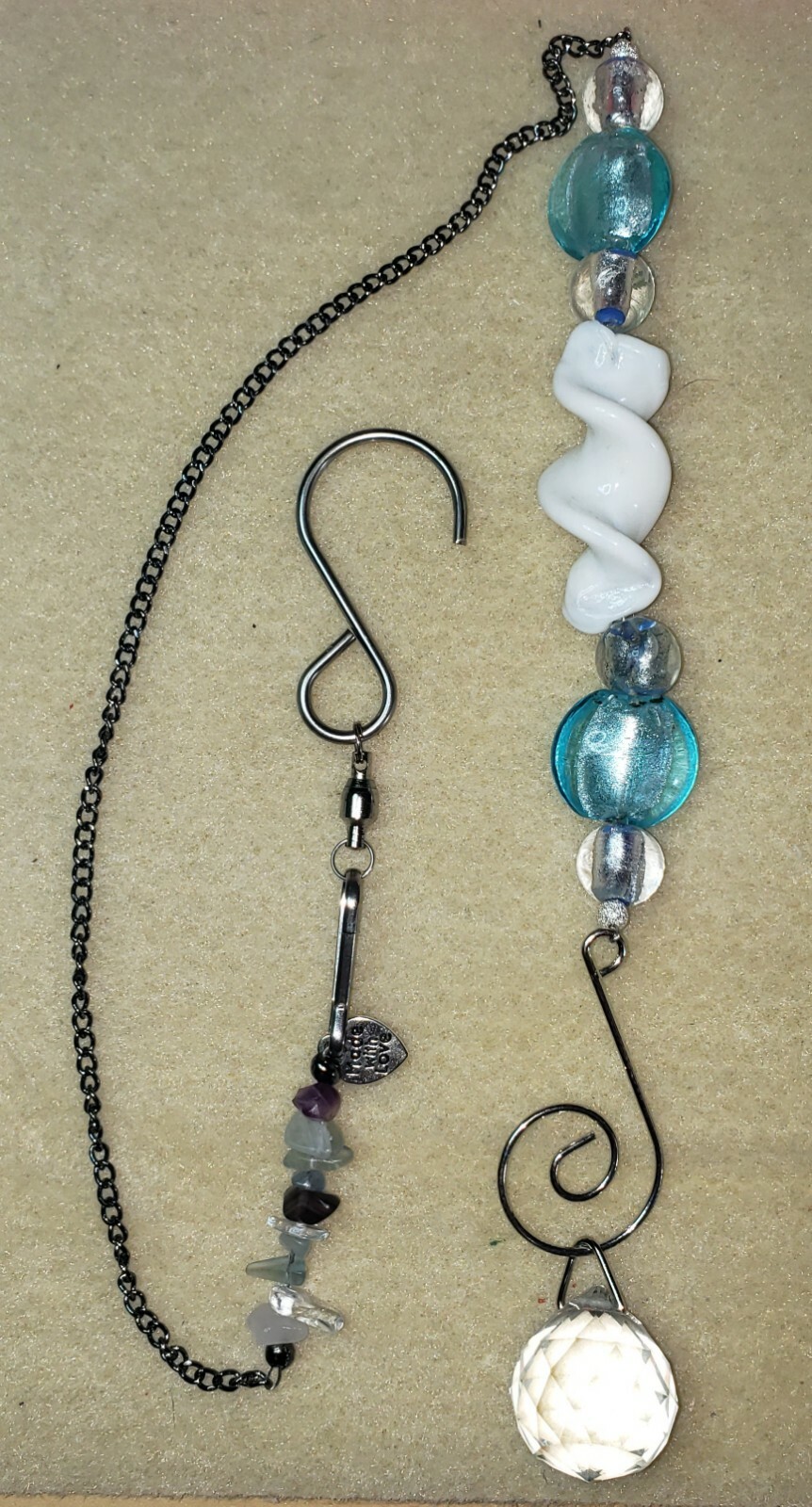 Turquoise and white spiral glass suncatcher with chain 20" length