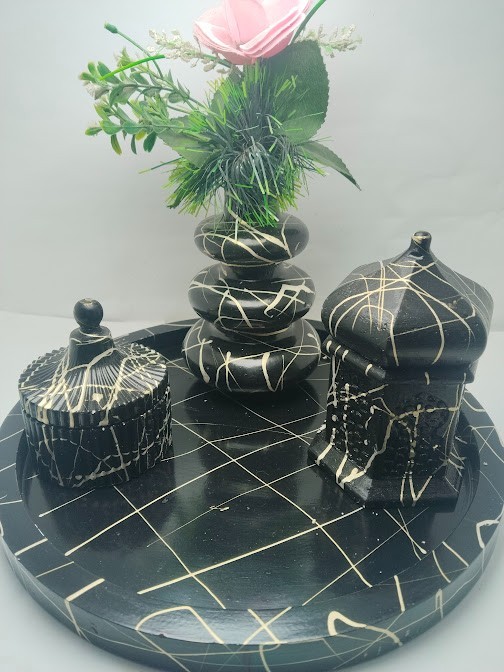 This decorative set consists of handcrafted art pieces including a round tray, a