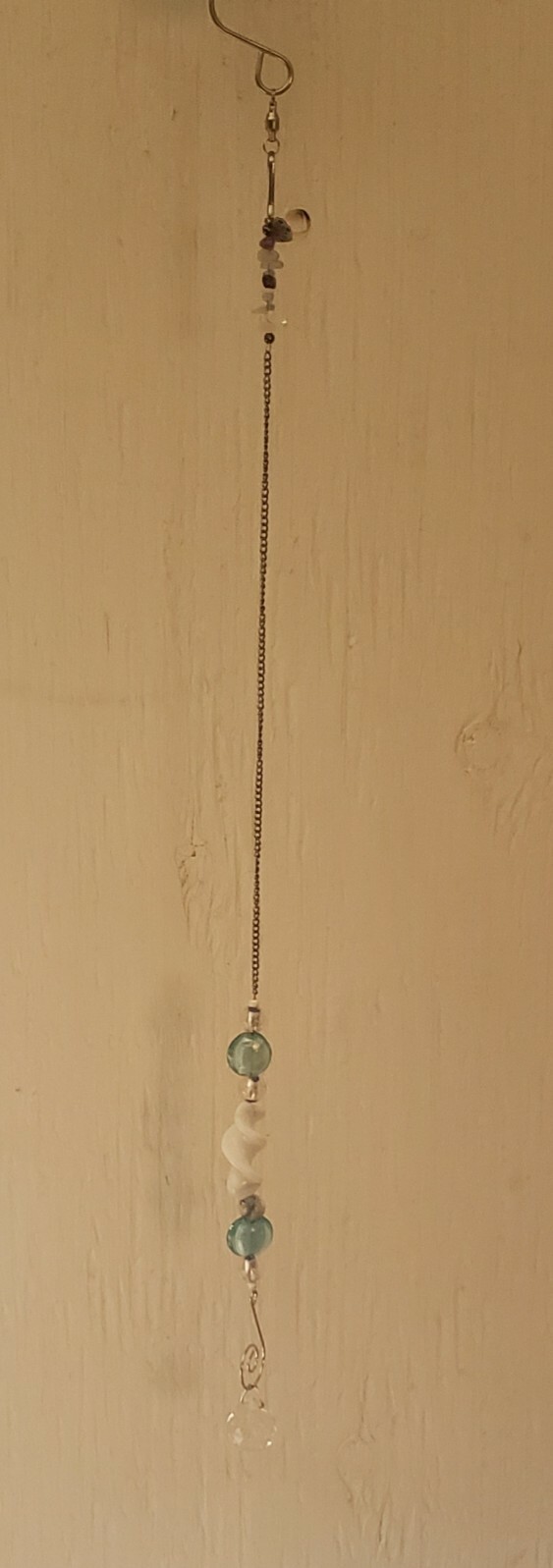 Turquoise and white spiral glass suncatcher with chain 20" length