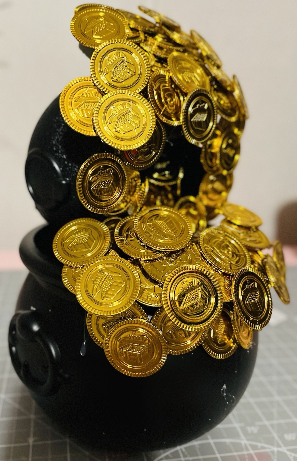 Plastic Gold Coins and Black Cauldron for Saint Patrick’s Day