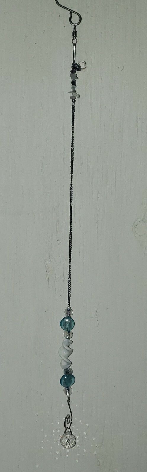 Turquoise and white spiral glass suncatcher with chain 20" length
