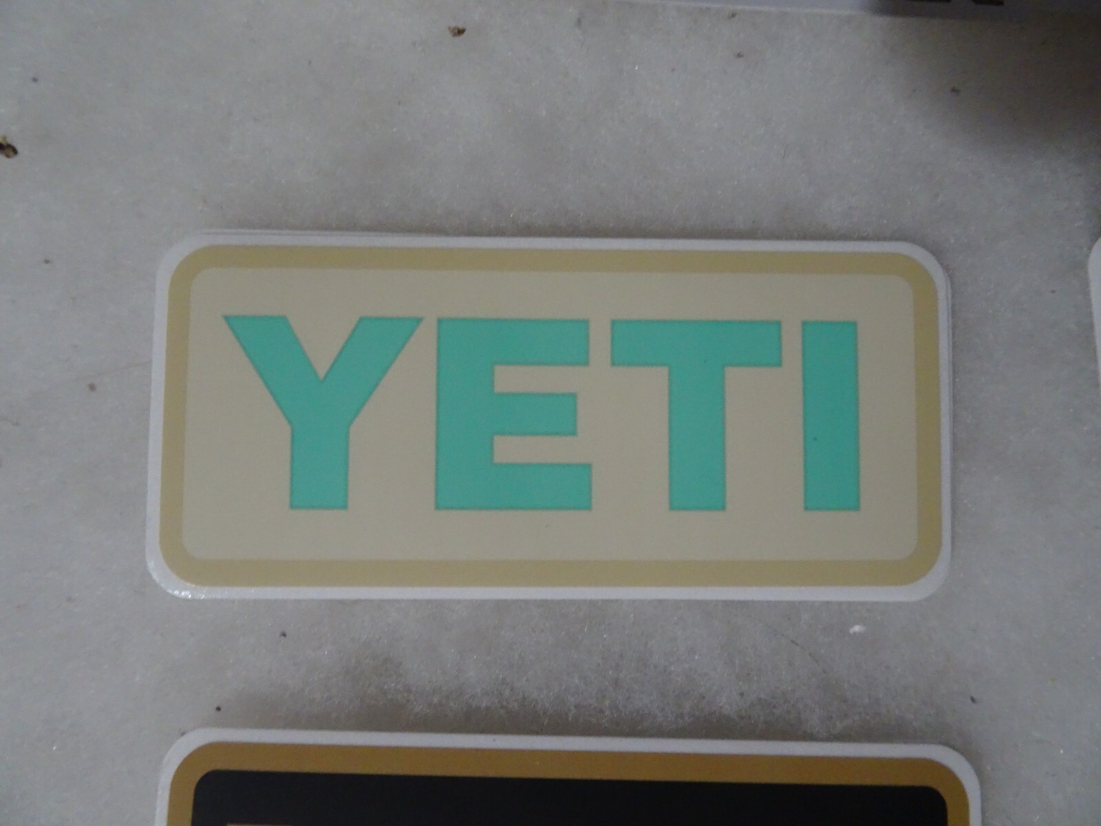 Authentic YETI Decal Sticker beige and aqua 4" x 1.75"