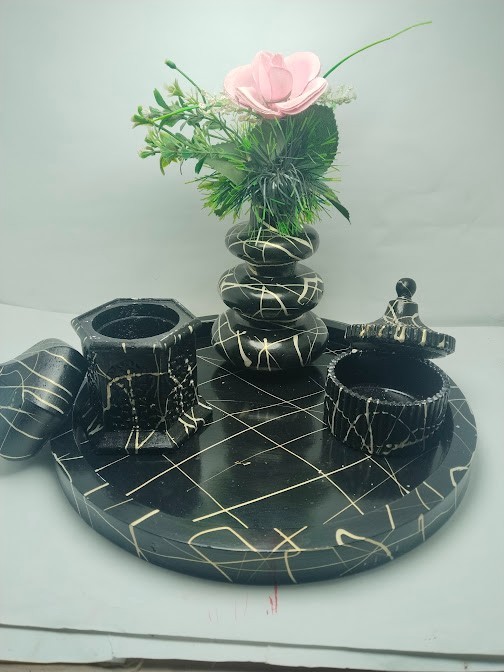 This decorative set consists of handcrafted art pieces including a round tray, a