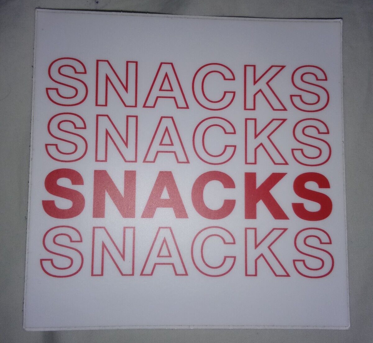 One Repeating Text Sticker: "Snacks" Design – 4.0" X 4.0"