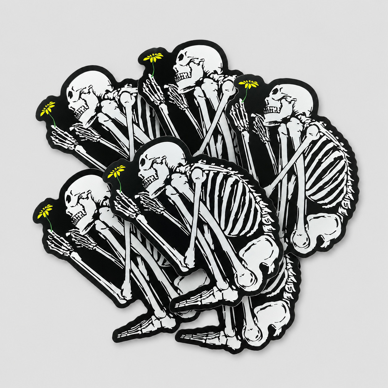 Crouching Skeleton Holding Flower Vinyl Sticker Gothic Art Decal for Laptops 4in