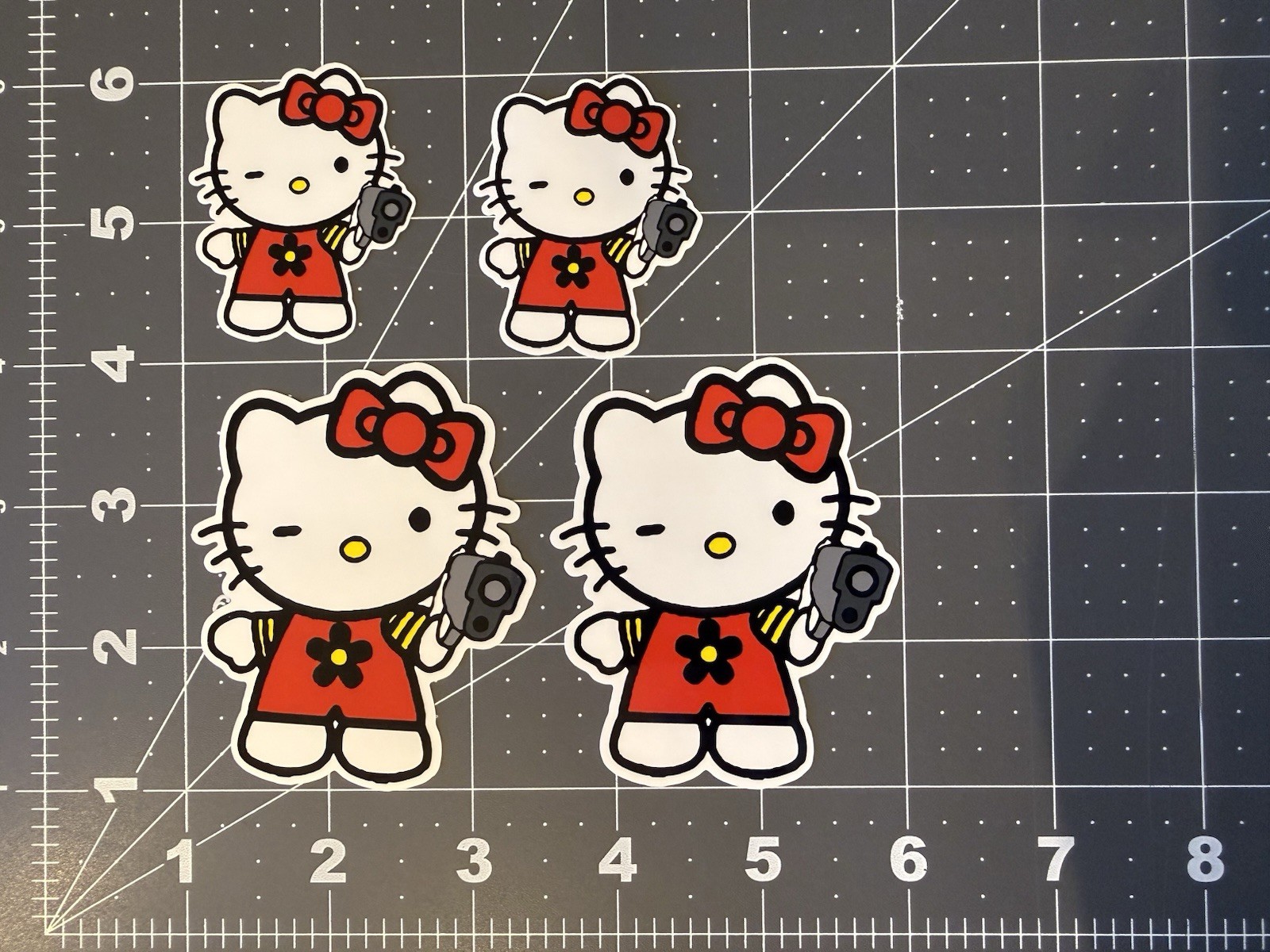 Hello Kitty Stickers Holding Gun Red 4 sticker Lot