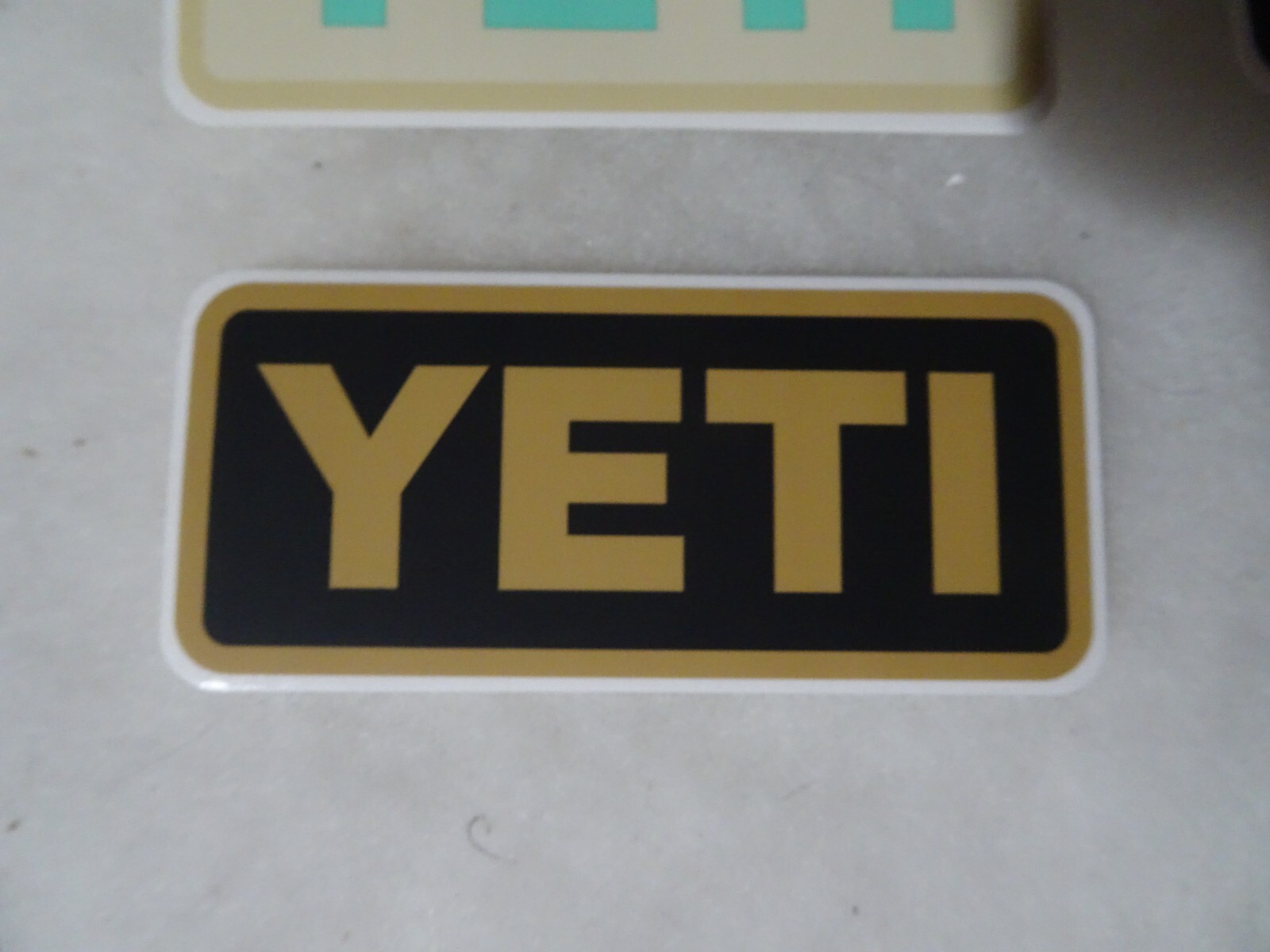 Authentic YETI Decal Sticker black and brown 4" x 1.75"