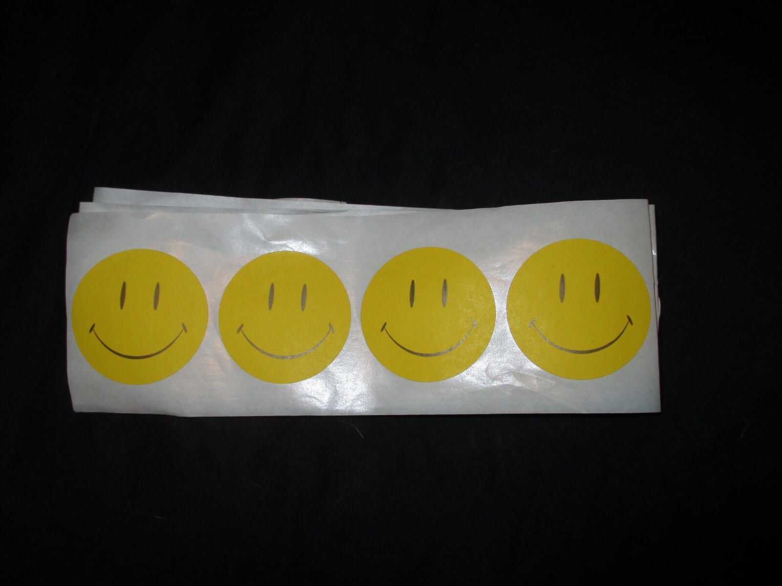 Yellow Smiley 2 in dia. 25 labels in roll form folded to fit a #10 envelope.