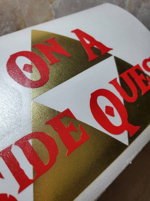 On A Side Quest Decal with Brushed Metallic Gold Vinyl 6"