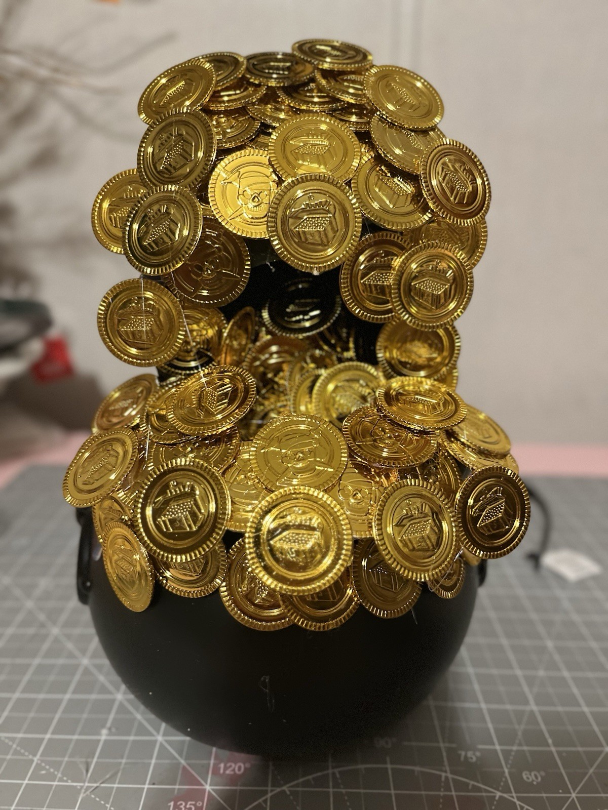 Plastic Gold Coins and Black Cauldron for Saint Patrick’s Day