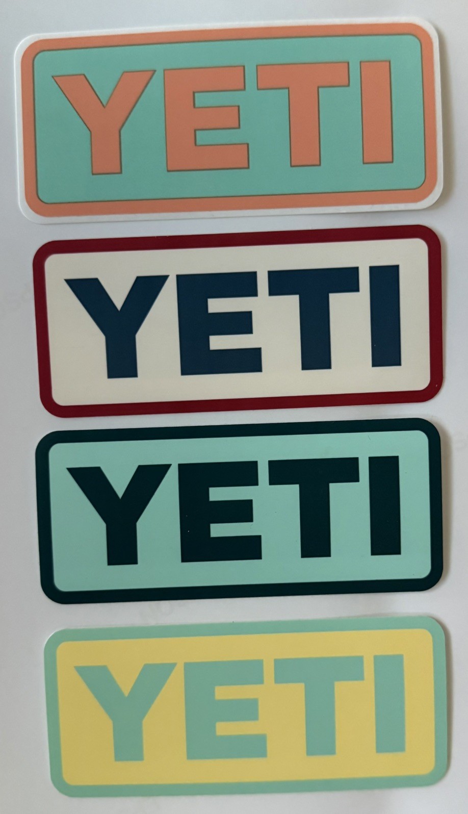 Yeti Stickers – Lot Of 4 approx 2” x 4” blue green yellow orange for cooler