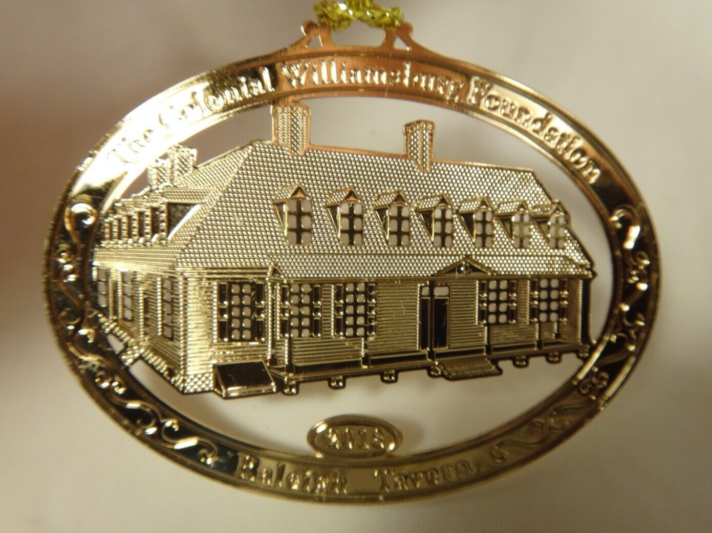 2018 Colonial Williamsburg Raleigh Tavern Oval Gold Finish Christmas Ornament