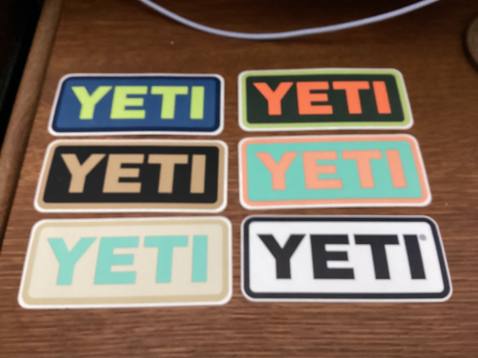 SIX DIFFERENT 4 X 1.75 INCH YETI STICKERS