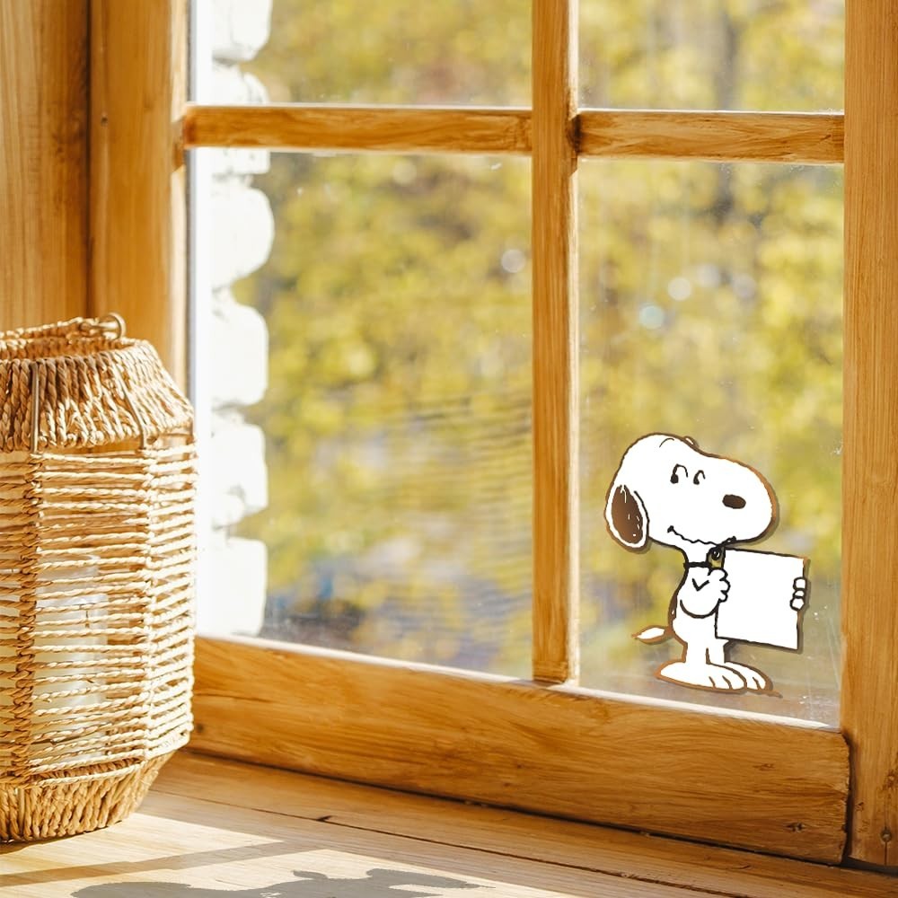 Peanuts cute sticker of Snoopy holding a white sign 4.5"H x 3"W