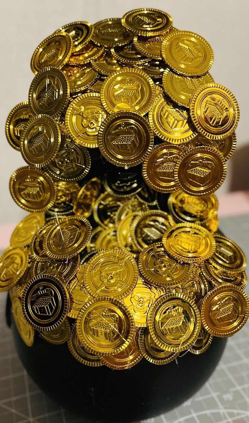 Plastic Gold Coins and Black Cauldron for Saint Patrick’s Day
