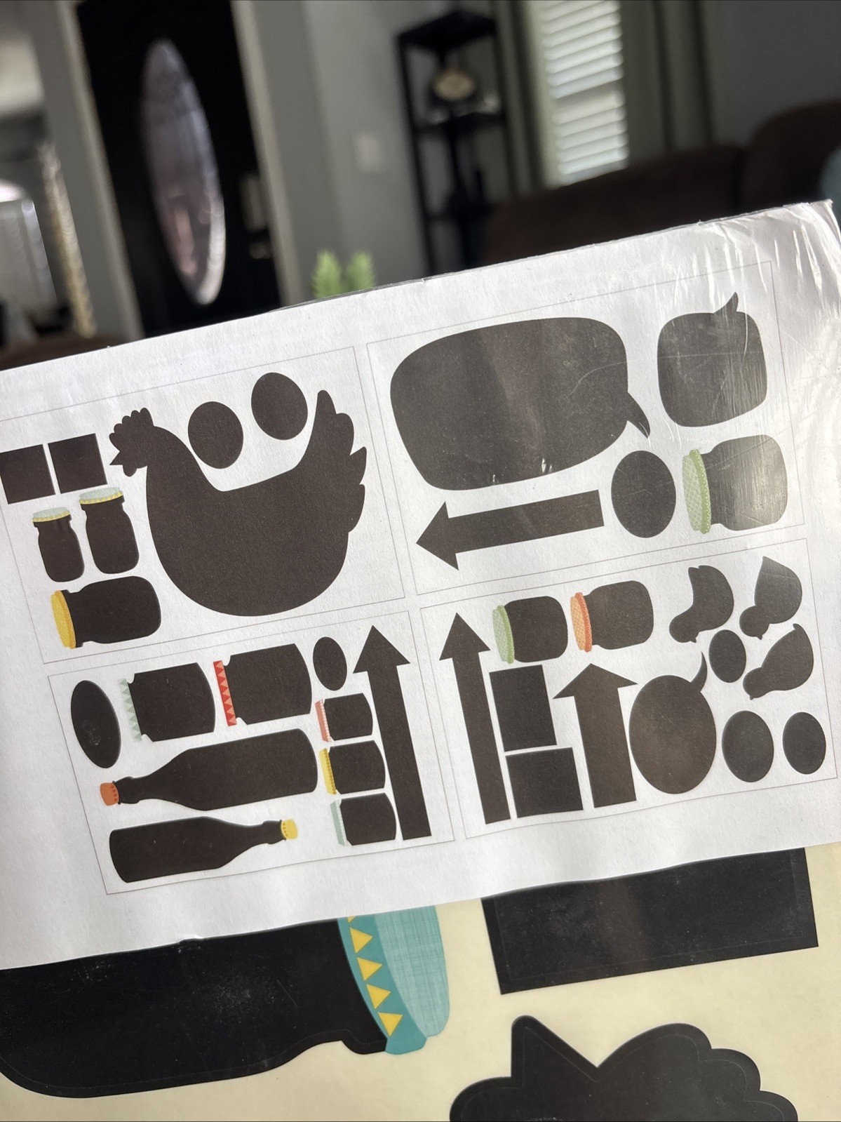 IKEA KLÄTTA wall stickers featuring black hen and bottle designs.