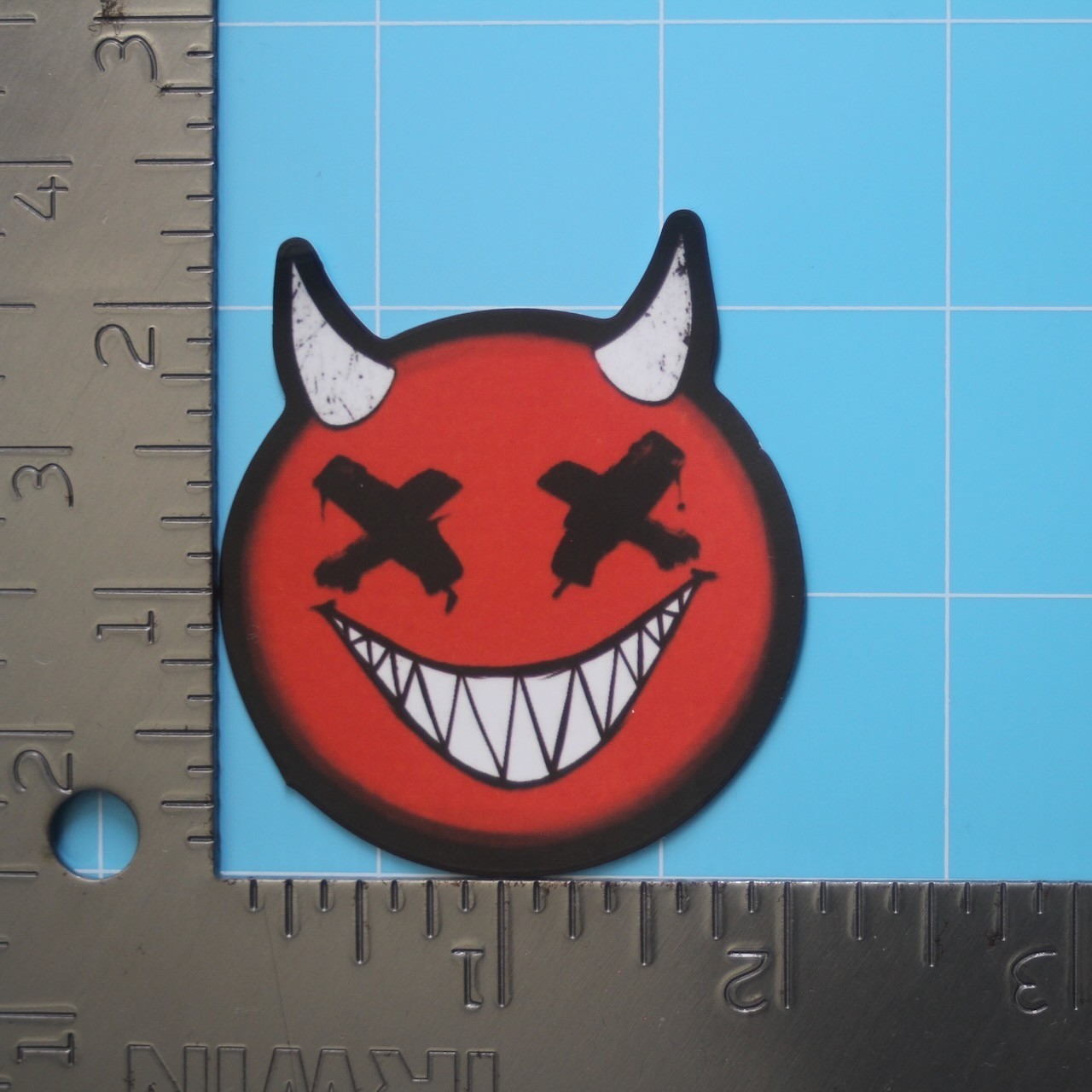 Horror Sticker (RED DEVIL GRIN SMILEY FACE) Creepy Halloween, Gloss PVC Decal