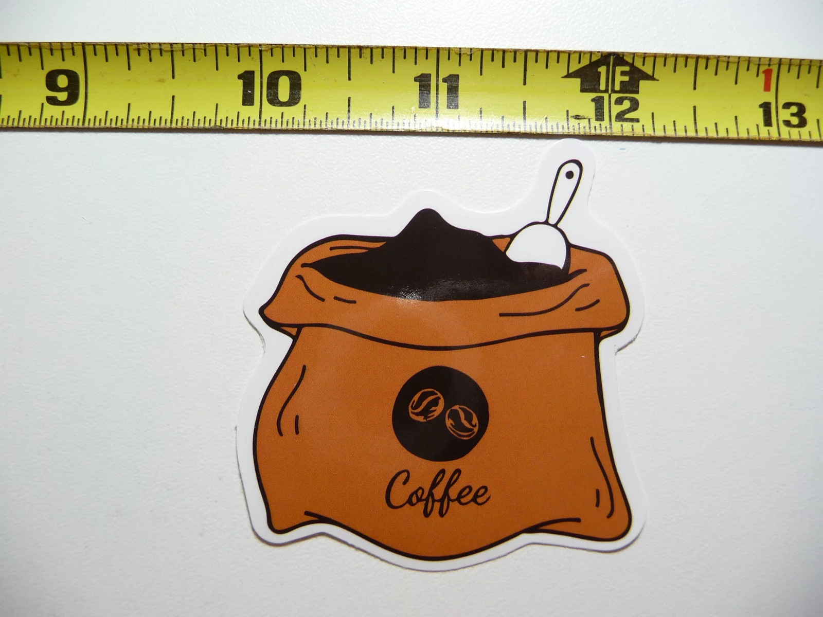 COFFEE WITH SCOOP IN BURLAP BAG SMALL STICKER DECAL BEVERAGE MORNING WAKE UP FUN