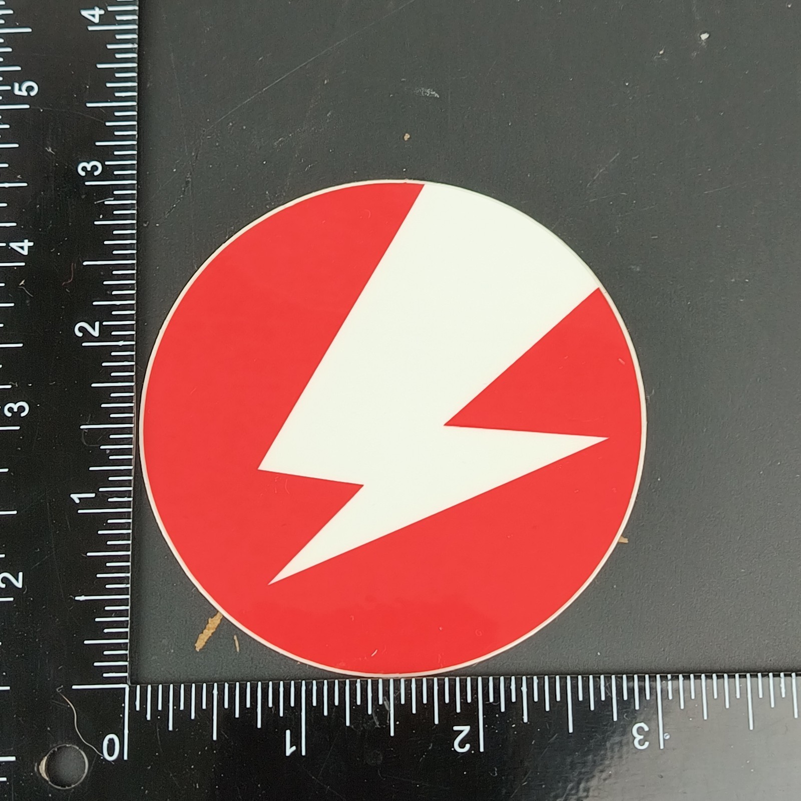 Unknown Lightning Bolt Decal Sticker White Bolt with Red Background Round 3 In